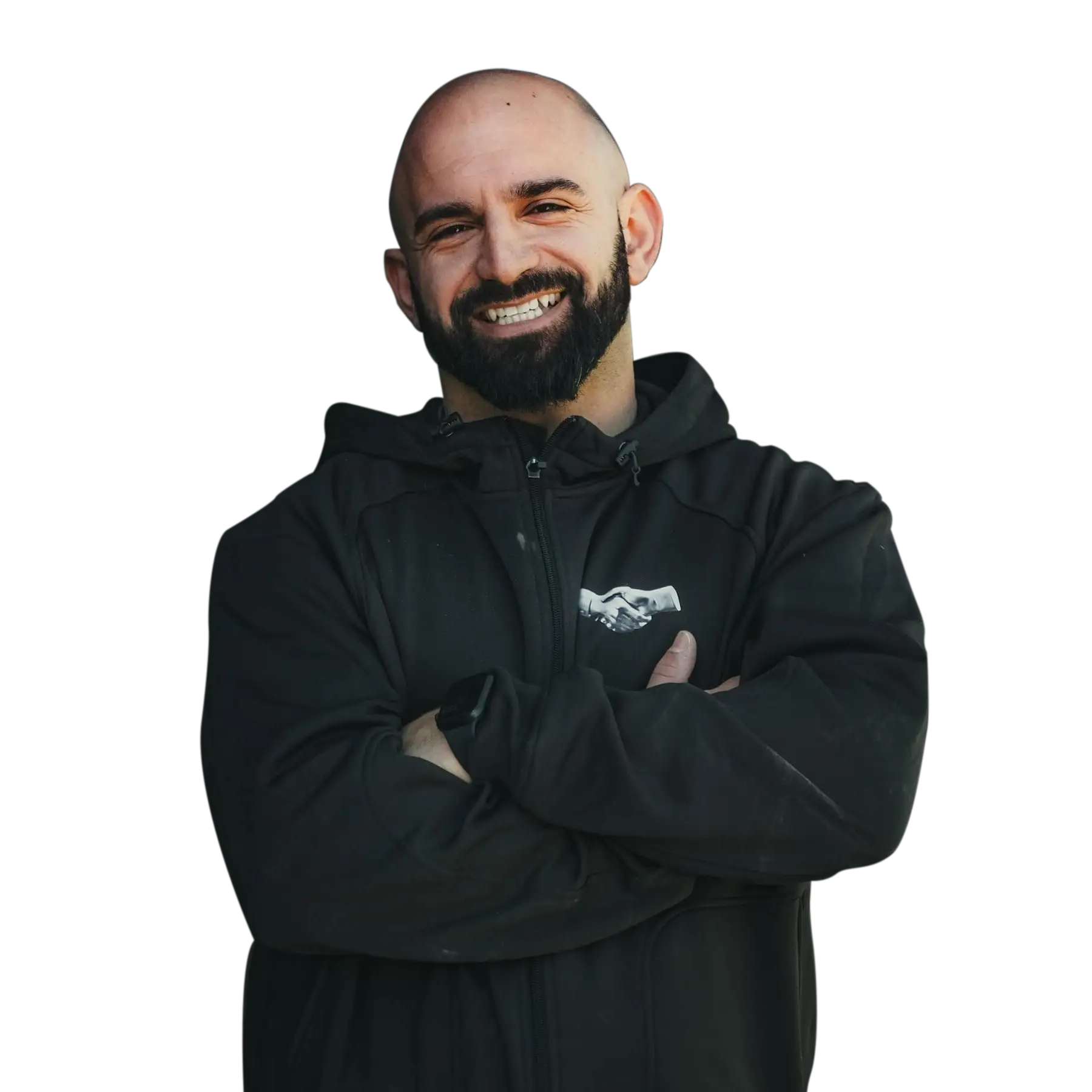 Iron Fibre Networks Bald man with a beard, wearing a black zip-up jacket with a Fibre Optic Cable Solutions & Services logo, stands with arms crossed and smiles at the camera against a plain white background. Fibre Optic Cable Solutions & Services